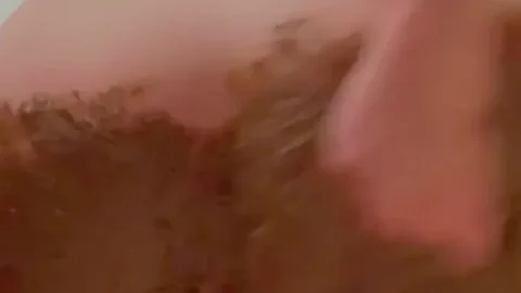 Brunette gets down and dirty with mud